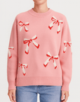 Meluvie | Oversized wool knit sweater with jacquard bow pattern