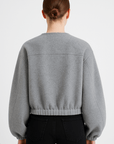 Clementine | Zip-Up Wool Bomber Jacket - Elastic Hem - Side Welt Pockets - Balloon Sleeves        Formulează o solicitare către ChatGPT