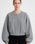 Clementine | Zip-Up Wool Bomber Jacket - Elastic Hem - Side Welt Pockets - Balloon Sleeves        Formulează o solicitare către ChatGPT