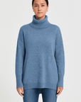 Petra | Women's Oversized Wool Knit Turtleneck Sweater – Asymmetrical Hem & Ribbed Sleeves
